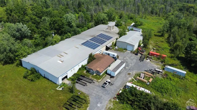 an aerial view of a house with a garden