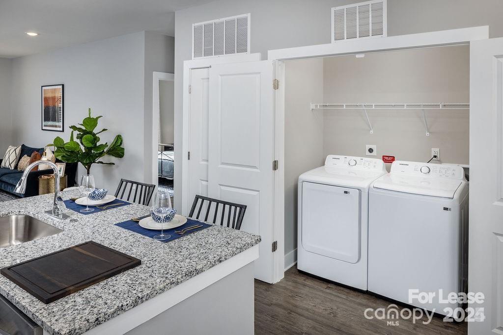 225 Rhyne Road, Unit A1 Charlotte, NC 28214 - Photo 33 of 48 a view of kitchen island with sink and refrigerator