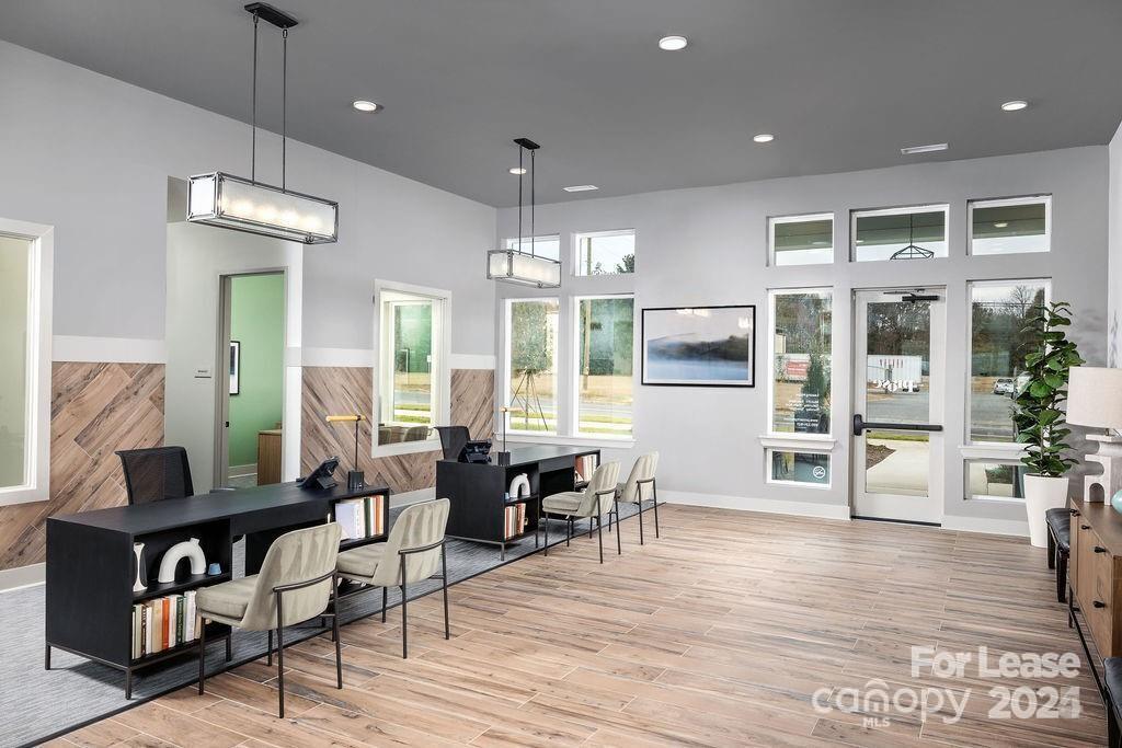225 Rhyne Road, Unit A1 Charlotte, NC 28214 - Photo 34 of 48 a view of a dining room with furniture window and wooden floor