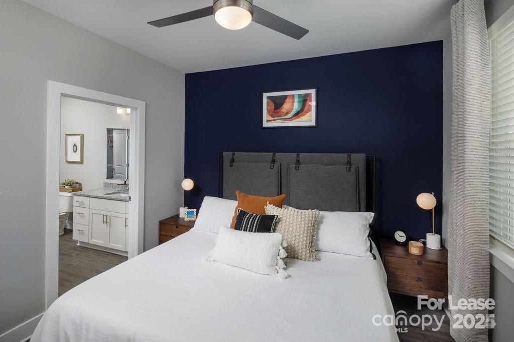 225 Rhyne Road, Unit A1 Charlotte, NC 28214 - Photo 36 of 48 a bedroom with a bed and a lamp