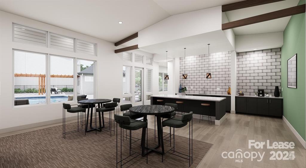 225 Rhyne Road, Unit A1 Charlotte, NC 28214 - Photo 6 of 48 a large dining hall with stainless steel appliances kitchen island granite countertop furniture and a large window