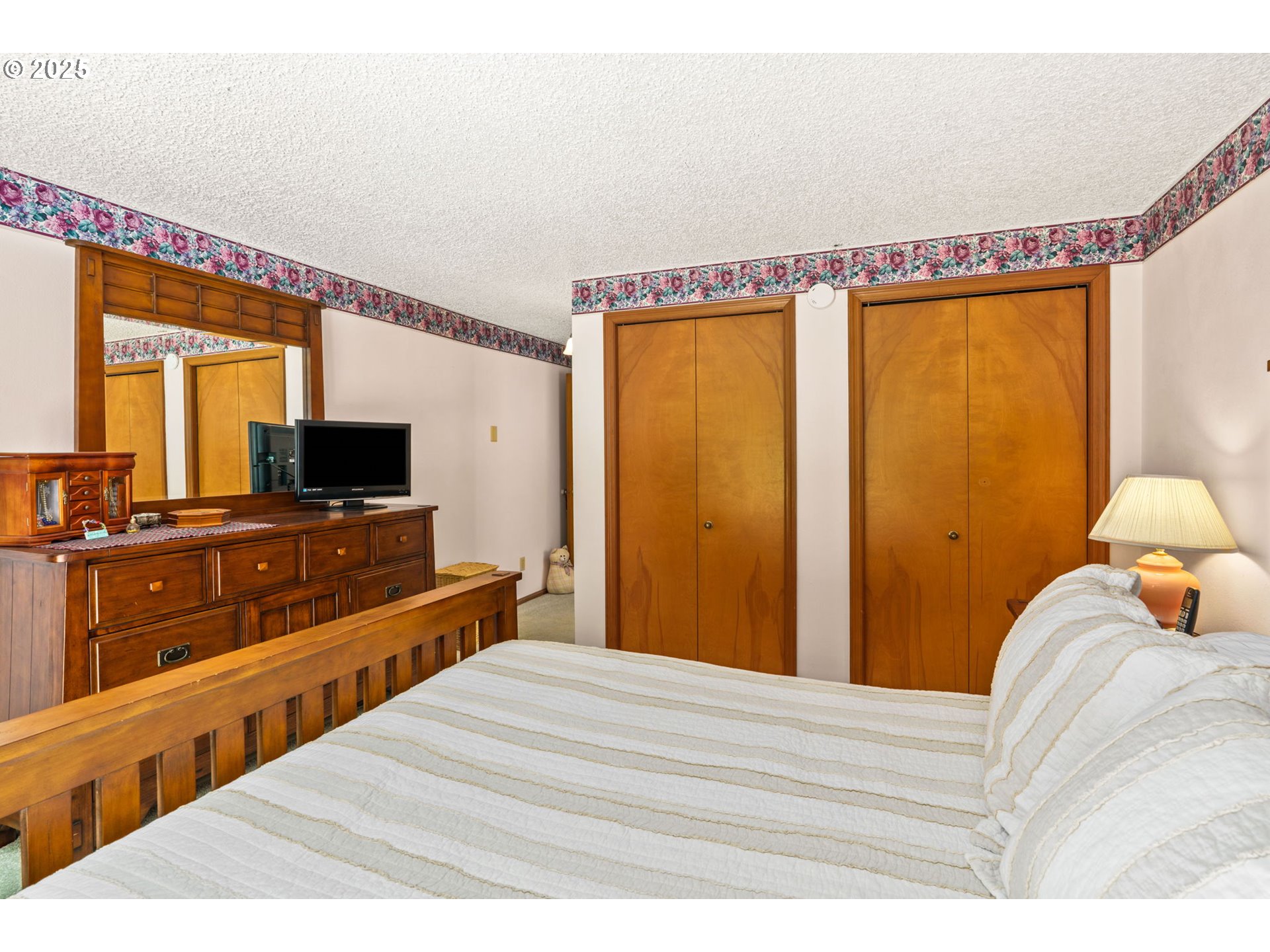 38754 Place Road Fall Creek, OR 97438 - Photo 22 of 48 a bedroom with a bed and a large mirror