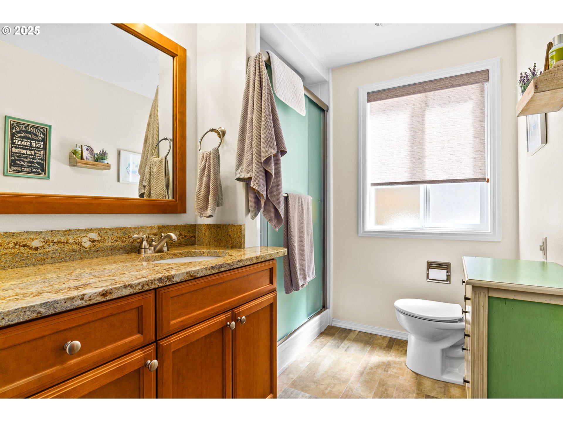 38754 Place Road Fall Creek, OR 97438 - Photo 24 of 48 a bathroom with a granite countertop sink toilet and a mirror