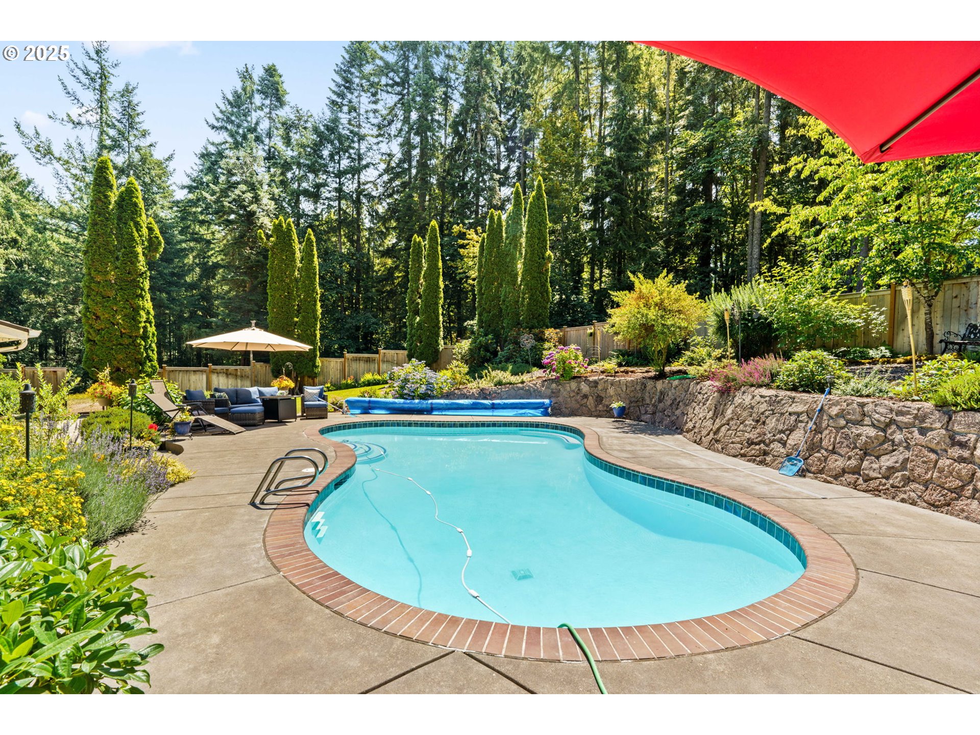 38754 Place Road Fall Creek, OR 97438 - Photo 30 of 48 a view of a swimming pool with an outdoor seating