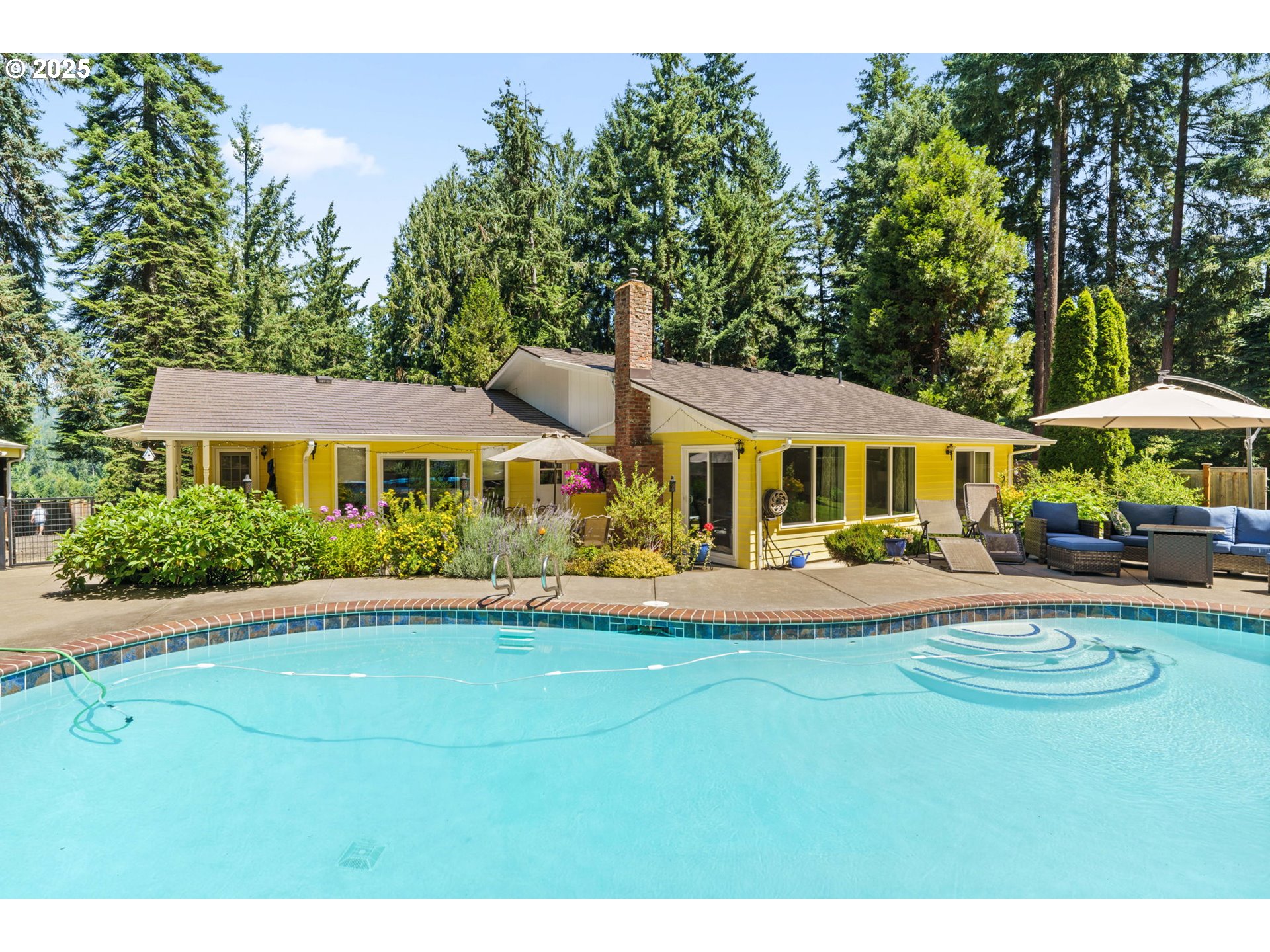 38754 Place Road Fall Creek, OR 97438 - Photo 31 of 48 a front view of a house with a yard table and chairs