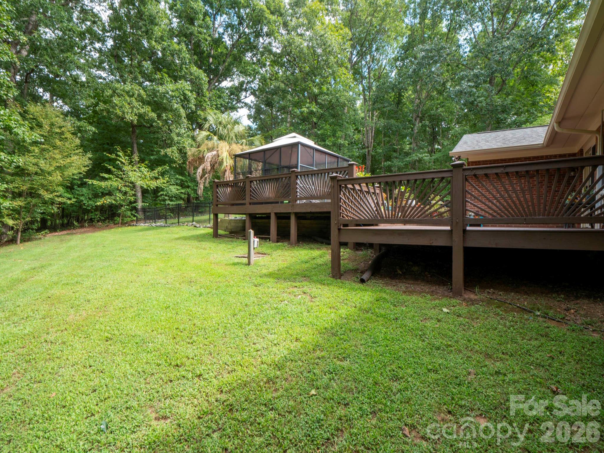 8720 Unionville-Brief Road Monroe, NC 28110 - Photo 4 of 35 a backyard of a house with table and chairs