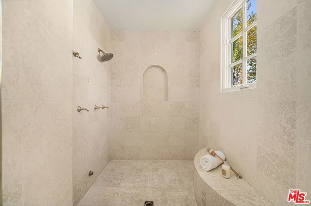 a spacious bedroom with a bed and a couch