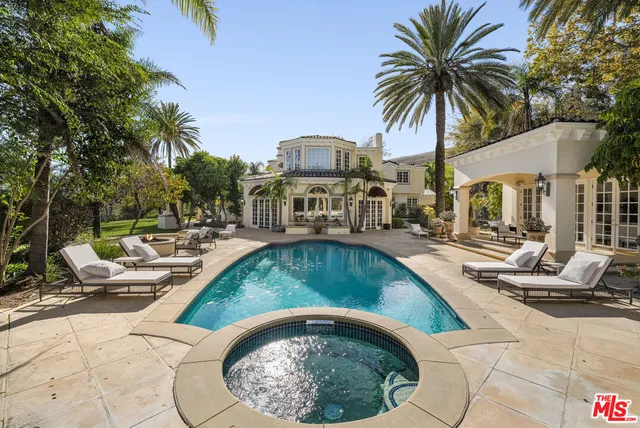 a view of outdoor space with swimming pool and patio