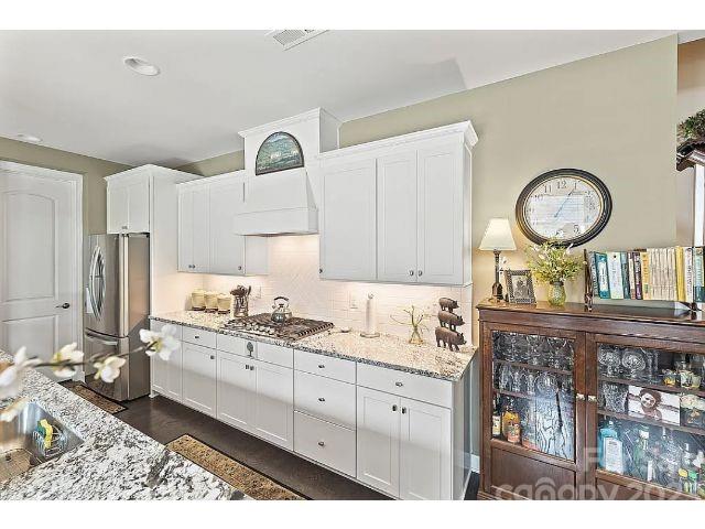 1292 Independence Street Fort Mill, SC 29708 - Photo 11 of 39 a kitchen with a sink and cabinets