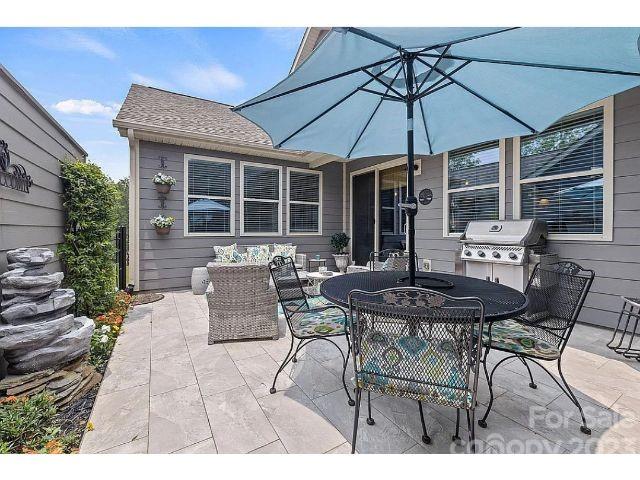 1292 Independence Street Fort Mill, SC 29708 - Photo 15 of 39 a view of a dinning table and chairs in the patio