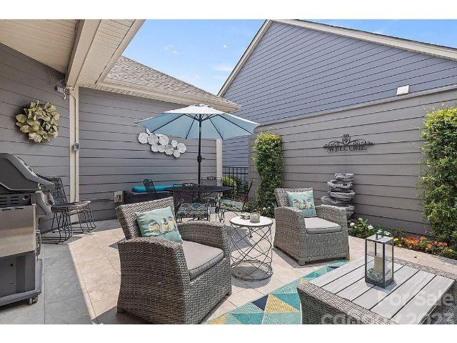 1292 Independence Street Fort Mill, SC 29708 - Photo 16 of 39 a outdoor space with patio the couches and a potted plant