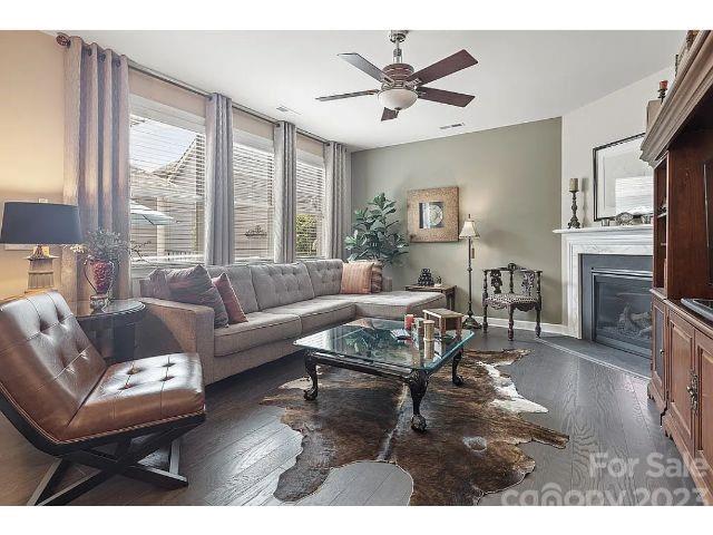 1292 Independence Street Fort Mill, SC 29708 - Photo 18 of 39 a living room with furniture a fireplace and a large window