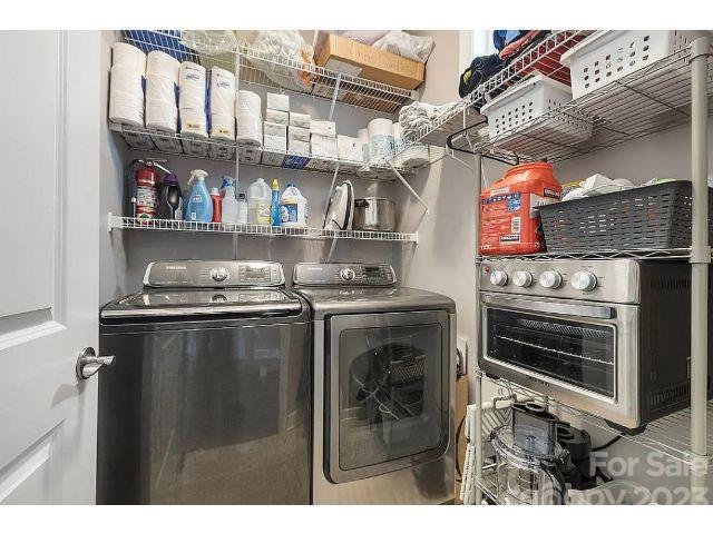 1292 Independence Street Fort Mill, SC 29708 - Photo 29 of 39 a kitchen with stainless steel appliances granite countertop a stove and a refrigerator
