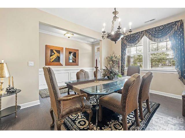 1292 Independence Street Fort Mill, SC 29708 - Photo 33 of 39 a view of a dining room with furniture wooden floor and chandelier