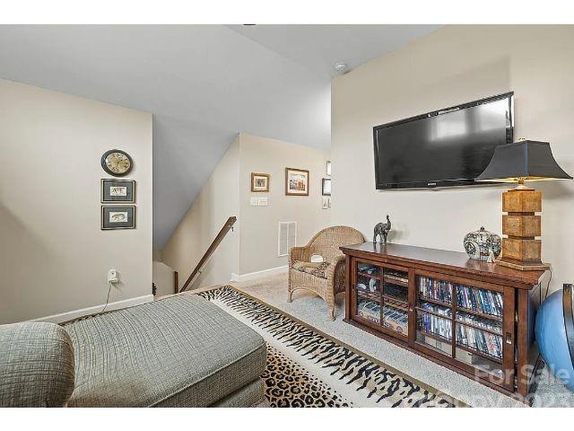 1292 Independence Street Fort Mill, SC 29708 - Photo 34 of 39 a living room with furniture and a flat screen tv