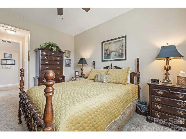 1292 Independence Street Fort Mill, SC 29708 - Photo 35 of 39 a bedroom with a bed and dresser with mirror