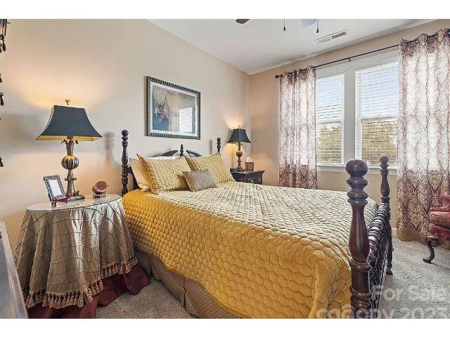 1292 Independence Street Fort Mill, SC 29708 - Photo 36 of 39 a bedroom with a bed and a lamp