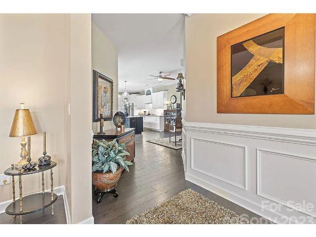 1292 Independence Street Fort Mill, SC 29708 - Photo 5 of 39 a view of living room filled with furniture and a painting on the wall
