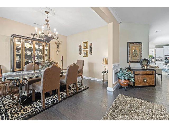 1292 Independence Street Fort Mill, SC 29708 - Photo 6 of 39 a living room with furniture and a chandelier
