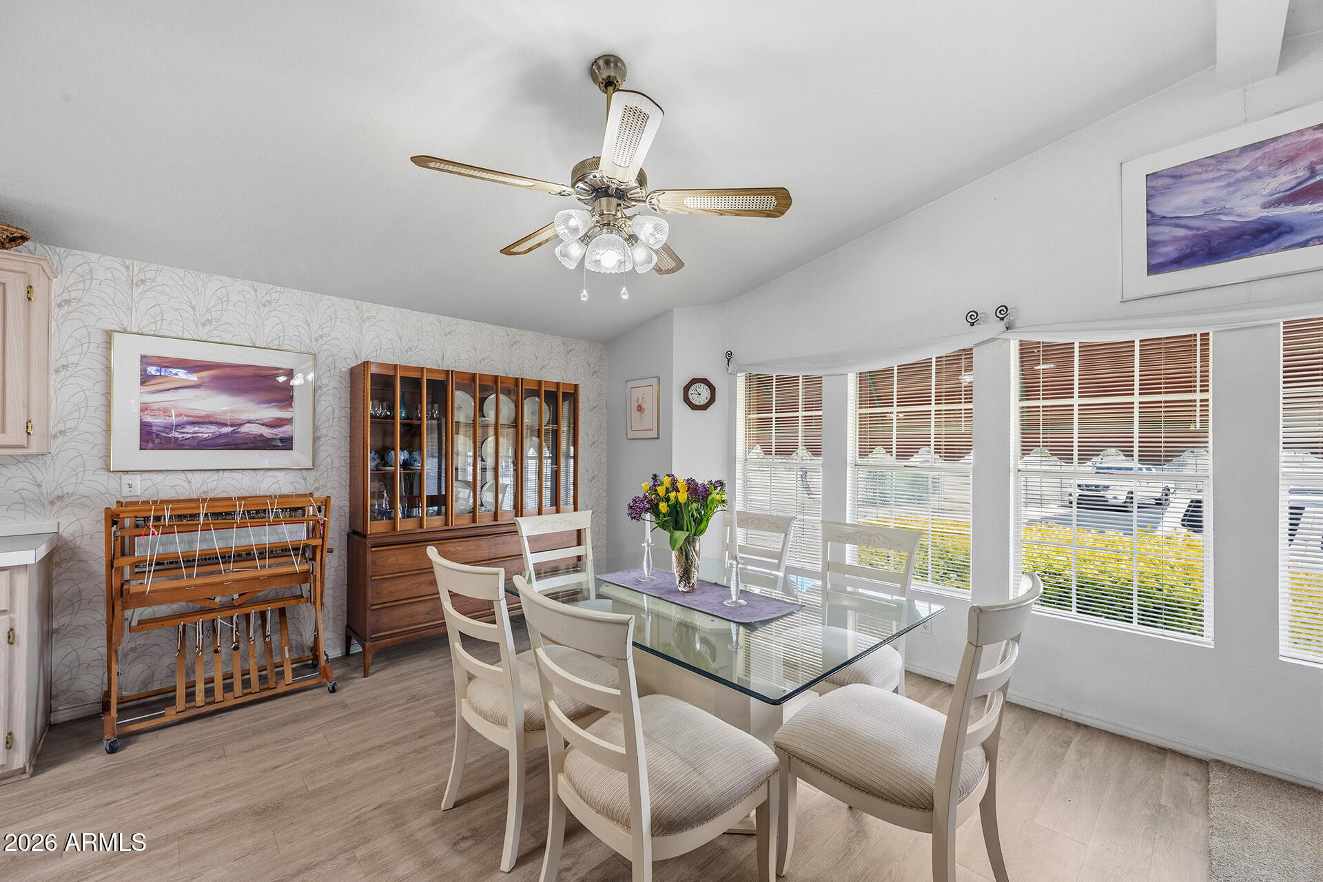 2701 East Utopia Road, Unit 153 Phoenix, AZ 85050 - Photo 12 of 26 a dining room with furniture a window and wooden floor