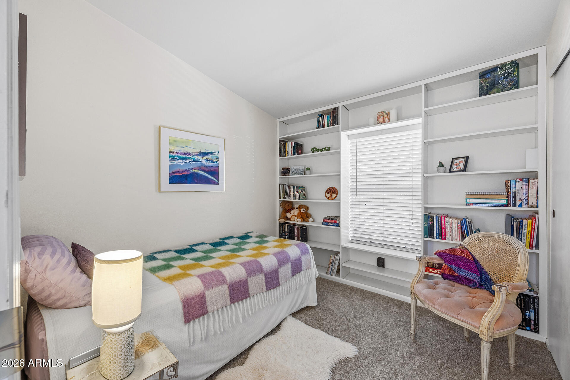 2701 East Utopia Road, Unit 153 Phoenix, AZ 85050 - Photo 19 of 26 a bedroom with a bed and furniture