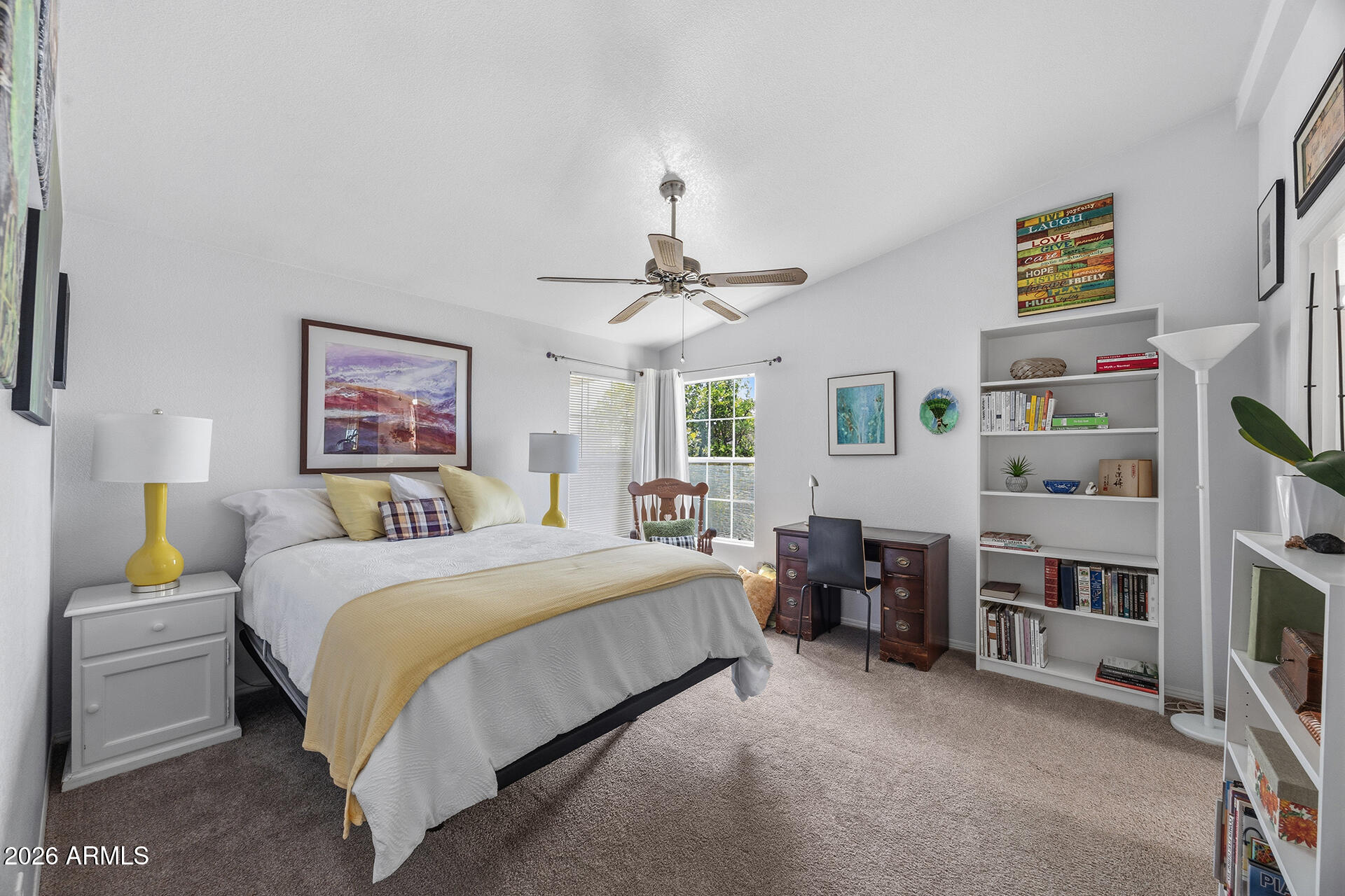 2701 East Utopia Road, Unit 153 Phoenix, AZ 85050 - Photo 20 of 26 a bedroom with a bed furniture and a chandelier