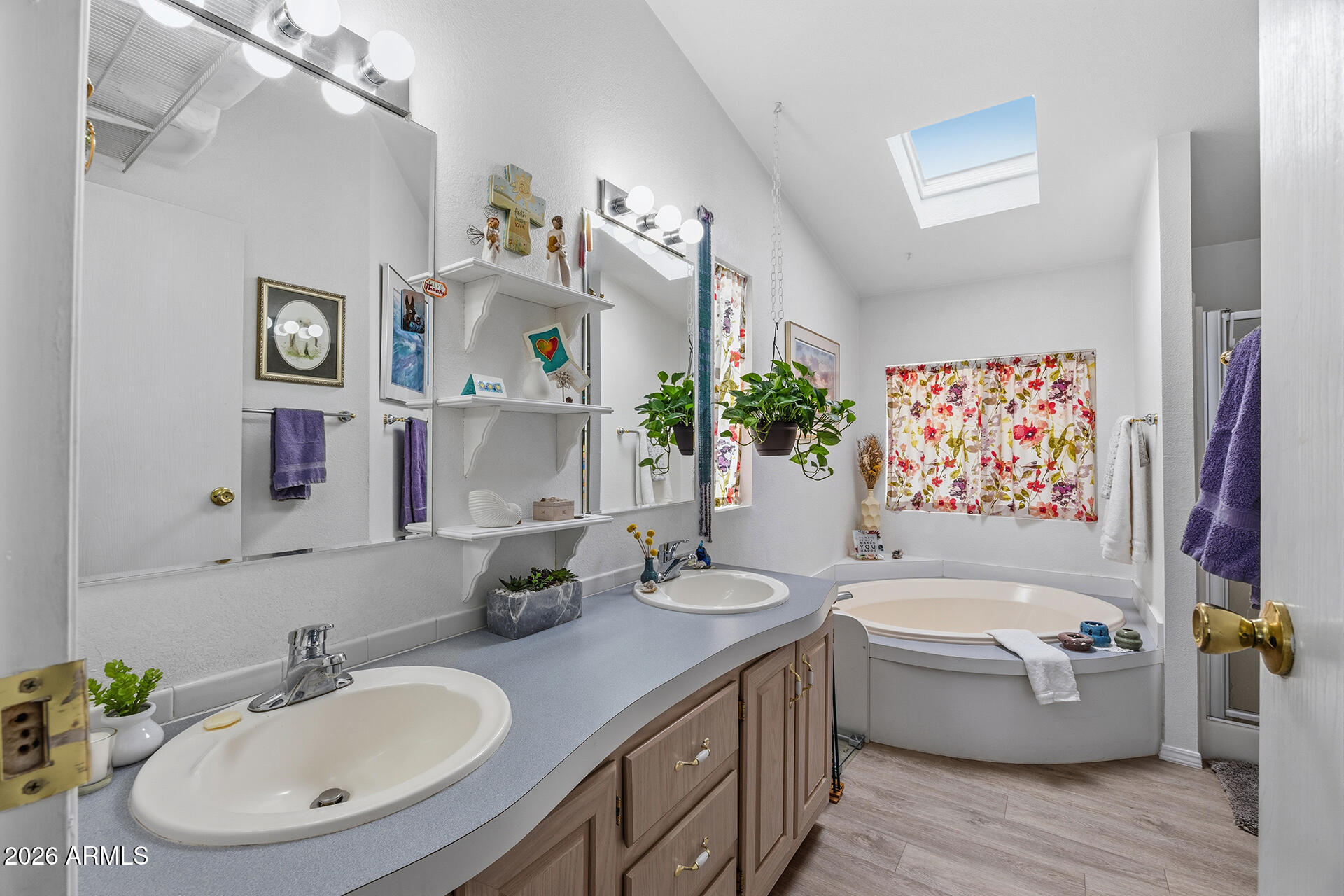2701 East Utopia Road, Unit 153 Phoenix, AZ 85050 - Photo 22 of 26 a bathroom with a bathtub sink mirror and vanity