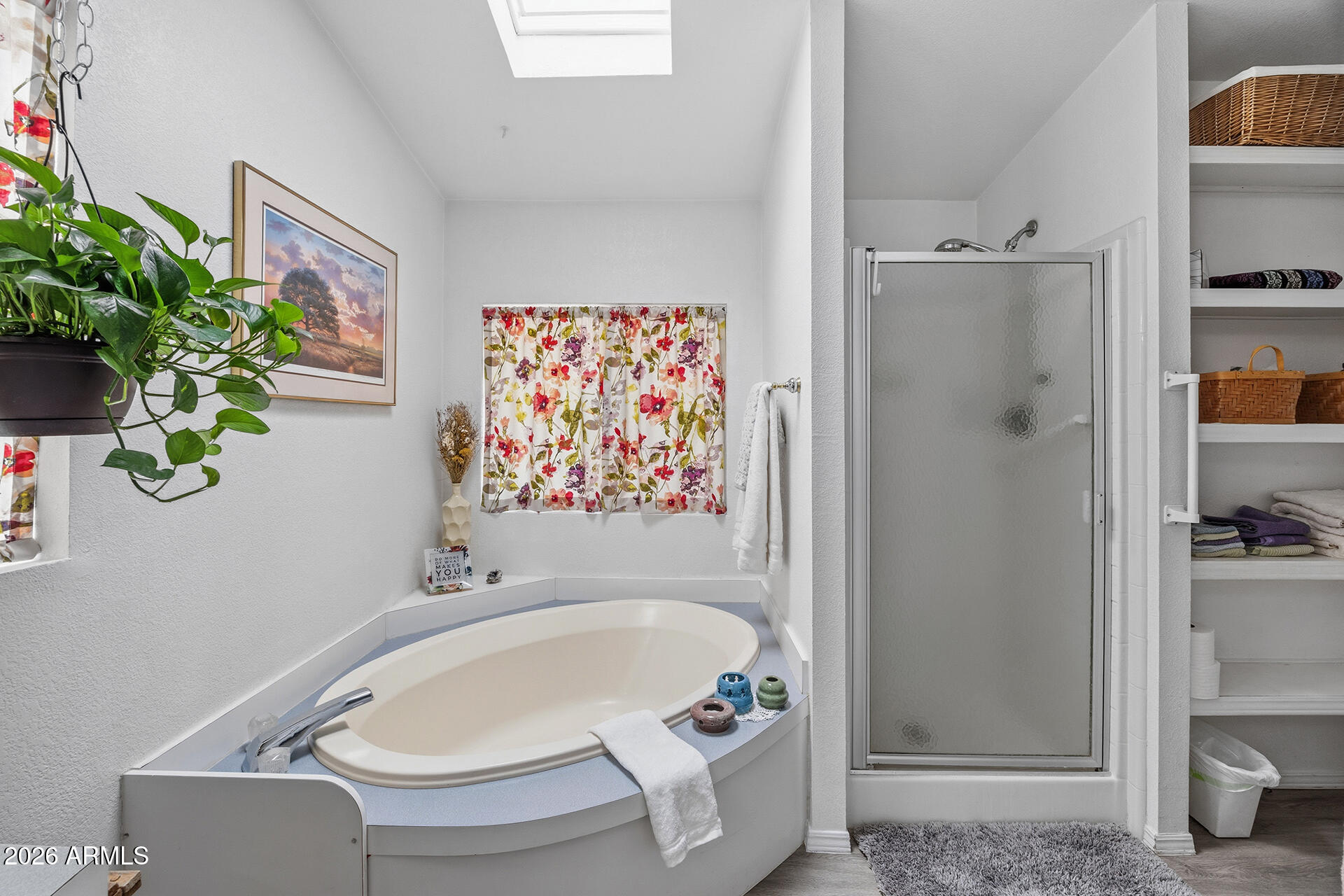 2701 East Utopia Road, Unit 153 Phoenix, AZ 85050 - Photo 23 of 26 a bathroom with a bathtub and a shower