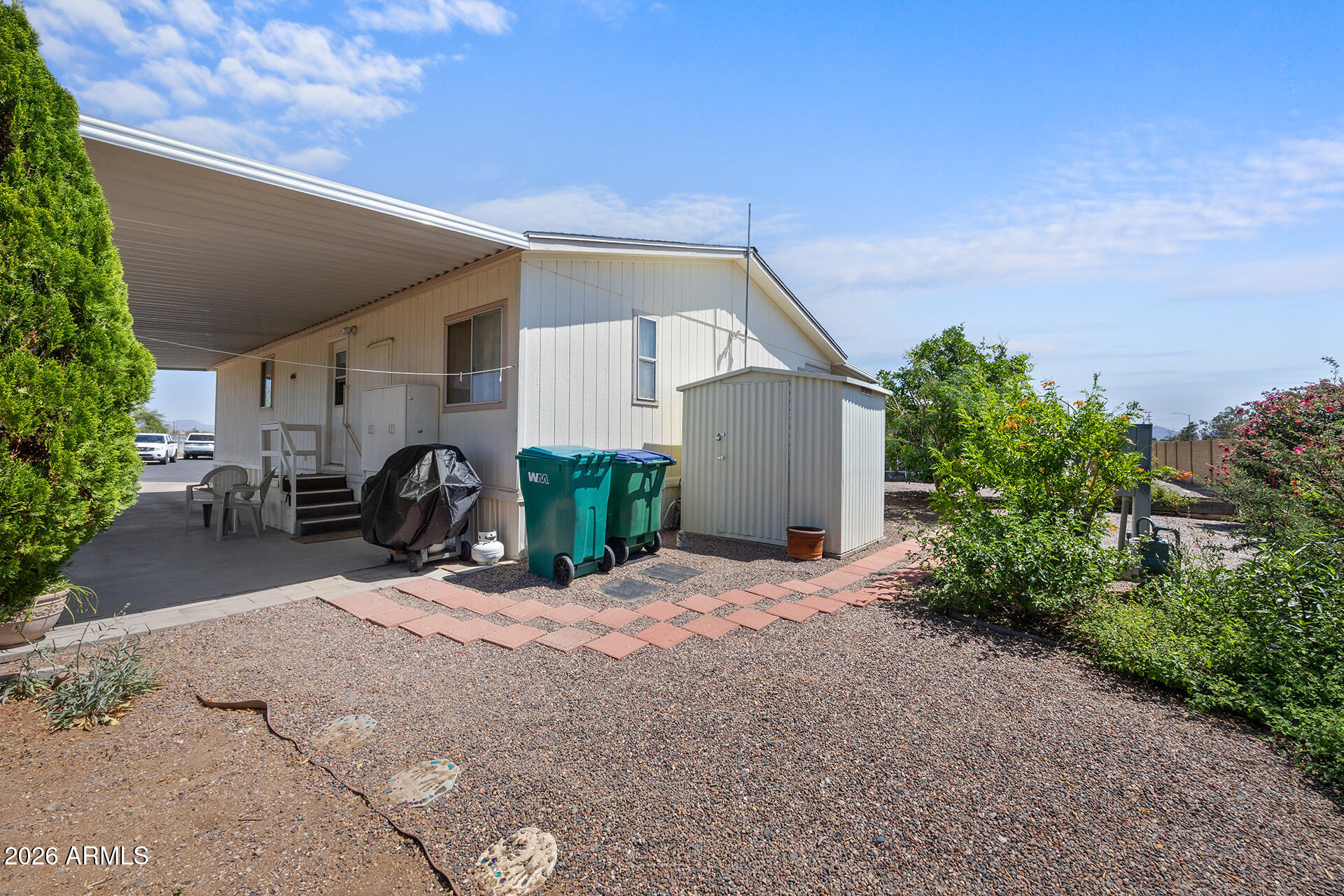 2701 East Utopia Road, Unit 153 Phoenix, AZ 85050 - Photo 24 of 26 a view of a house with porch and furniture