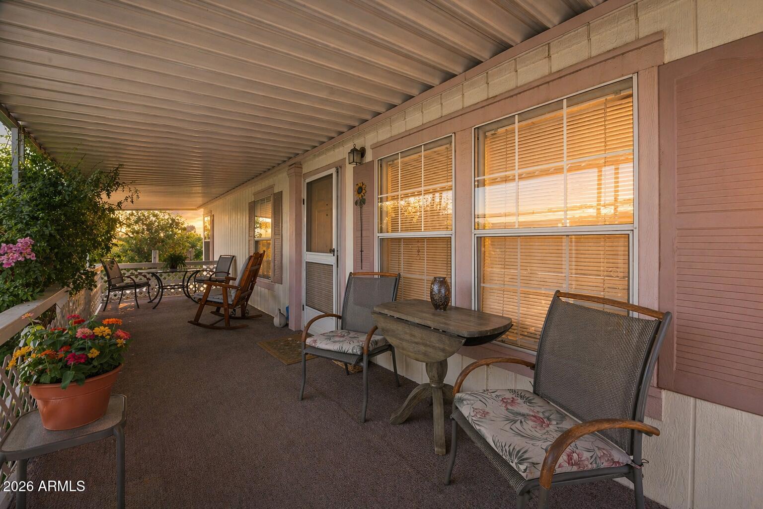 2701 East Utopia Road, Unit 153 Phoenix, AZ 85050 - Photo 8 of 26 a living room with furniture and a potted plant
