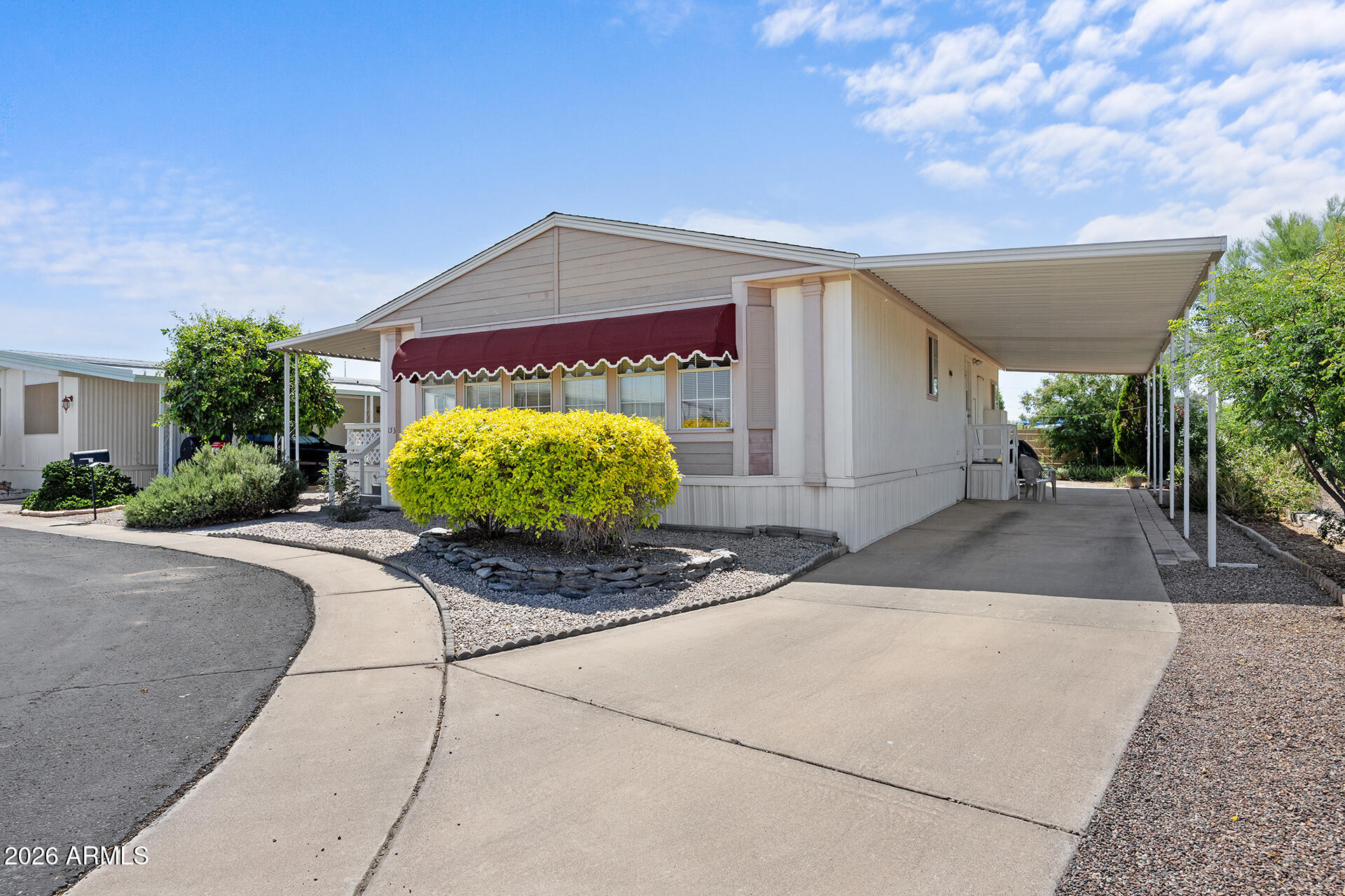 2701 East Utopia Road, Unit 153 Phoenix, AZ 85050 - Photo 9 of 26 a view of a house with a patio