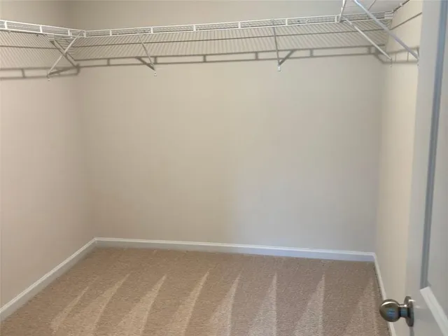 a view of a room with racks on the wall