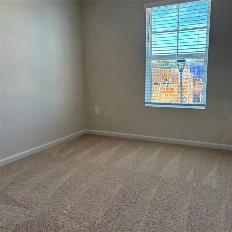 9440 Maple Grove Lane Jonesboro, GA 30238 - Photo 16 of 21 an empty room with a window