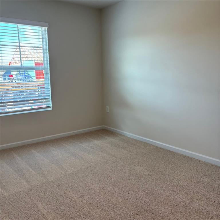 9440 Maple Grove Lane Jonesboro, GA 30238 - Photo 17 of 21 an empty room with a window