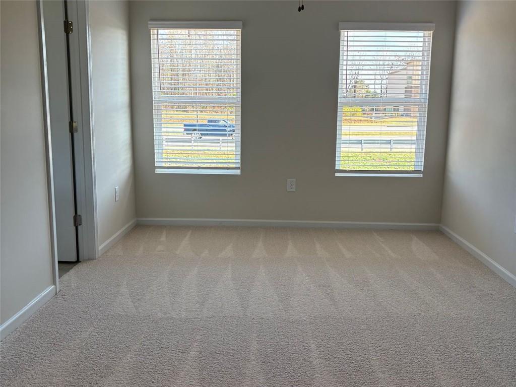 9440 Maple Grove Lane Jonesboro, GA 30238 - Photo 10 of 21 a view of an empty room with a window