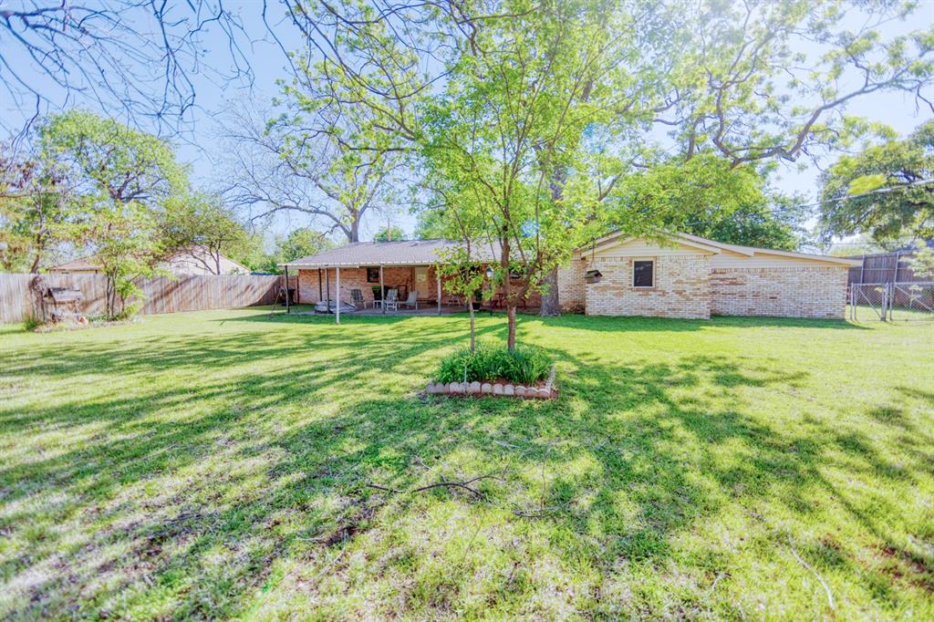 700 South Washington Street Pilot Point, TX 76258 - Photo 13 of 14 a view of a house with a big yard
