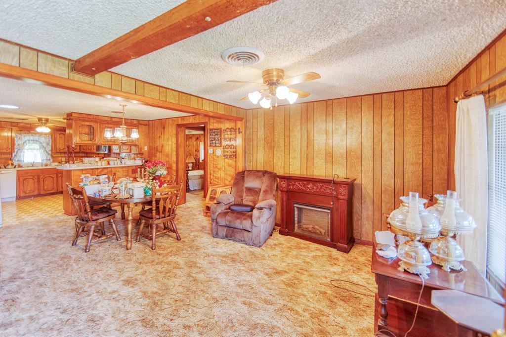 700 South Washington Street Pilot Point, TX 76258 - Photo 3 of 14 a room with lots of white furniture and chandelier