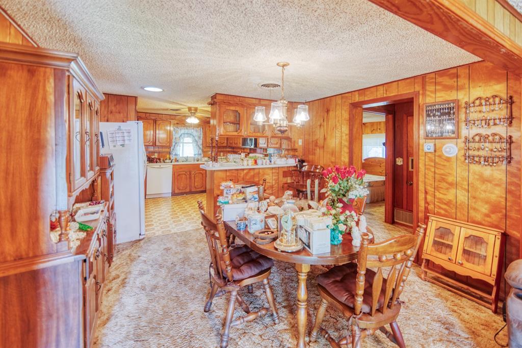 700 South Washington Street Pilot Point, TX 76258 - Photo 4 of 14 a view of a dining room with furniture window and outside view