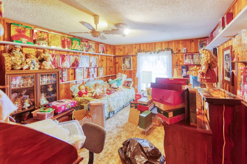 700 South Washington Street Pilot Point, TX 76258 - Photo 6 of 14 a living room with patio furniture and a window