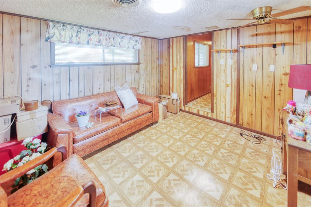 700 South Washington Street Pilot Point, TX 76258 - Photo 9 of 14 a living room with furniture and a large window