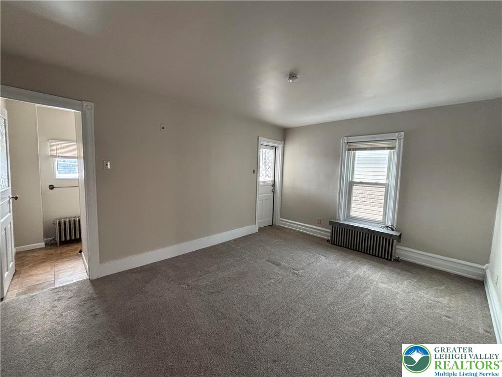 418 Ridge Street, Unit 2 Emmaus, PA 18049 - Photo 13 of 13 an empty room with windows