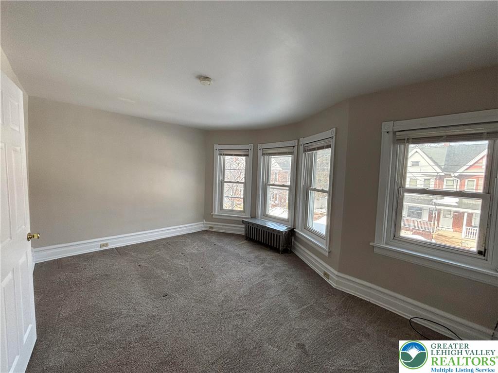 418 Ridge Street, Unit 2 Emmaus, PA 18049 - Photo 6 of 13 an empty room with windows