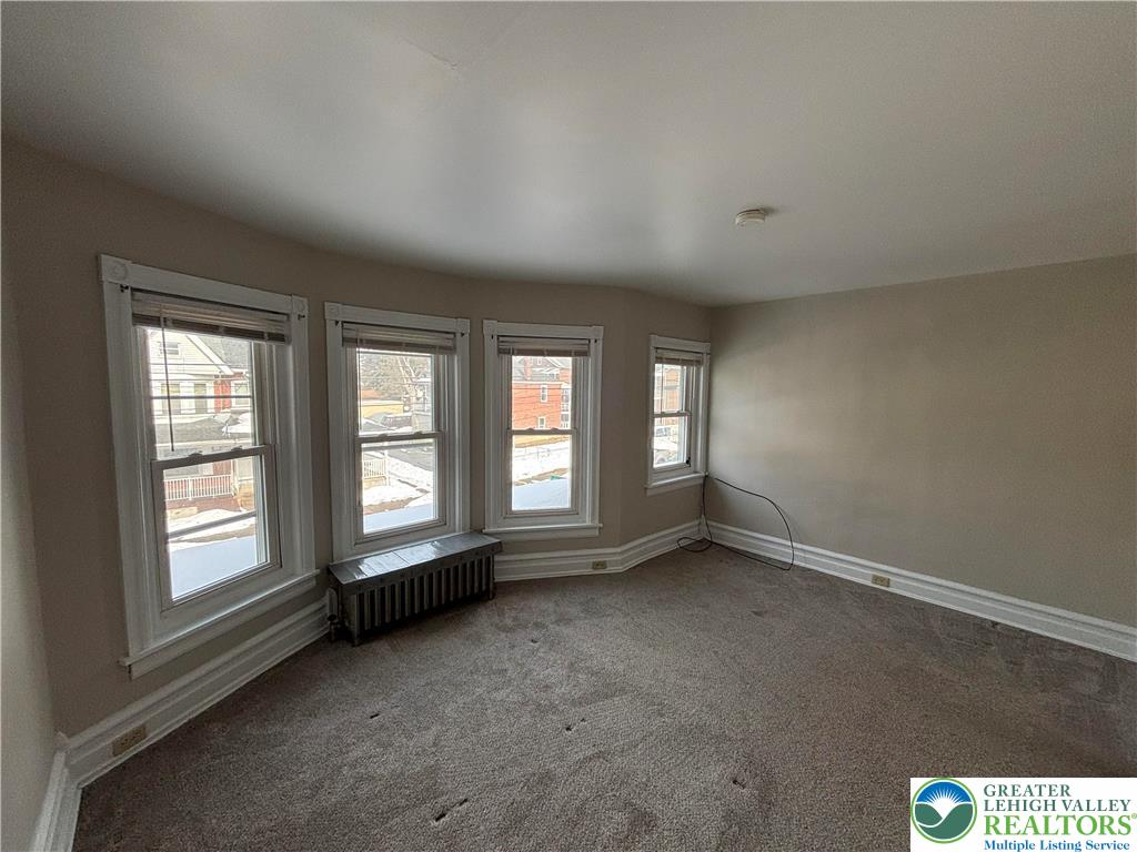 418 Ridge Street, Unit 2 Emmaus, PA 18049 - Photo 7 of 13 an empty room with a window