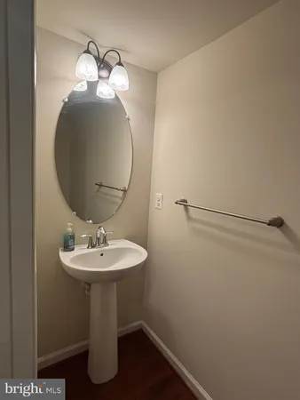 a bathroom with a sink a mirror and vanity