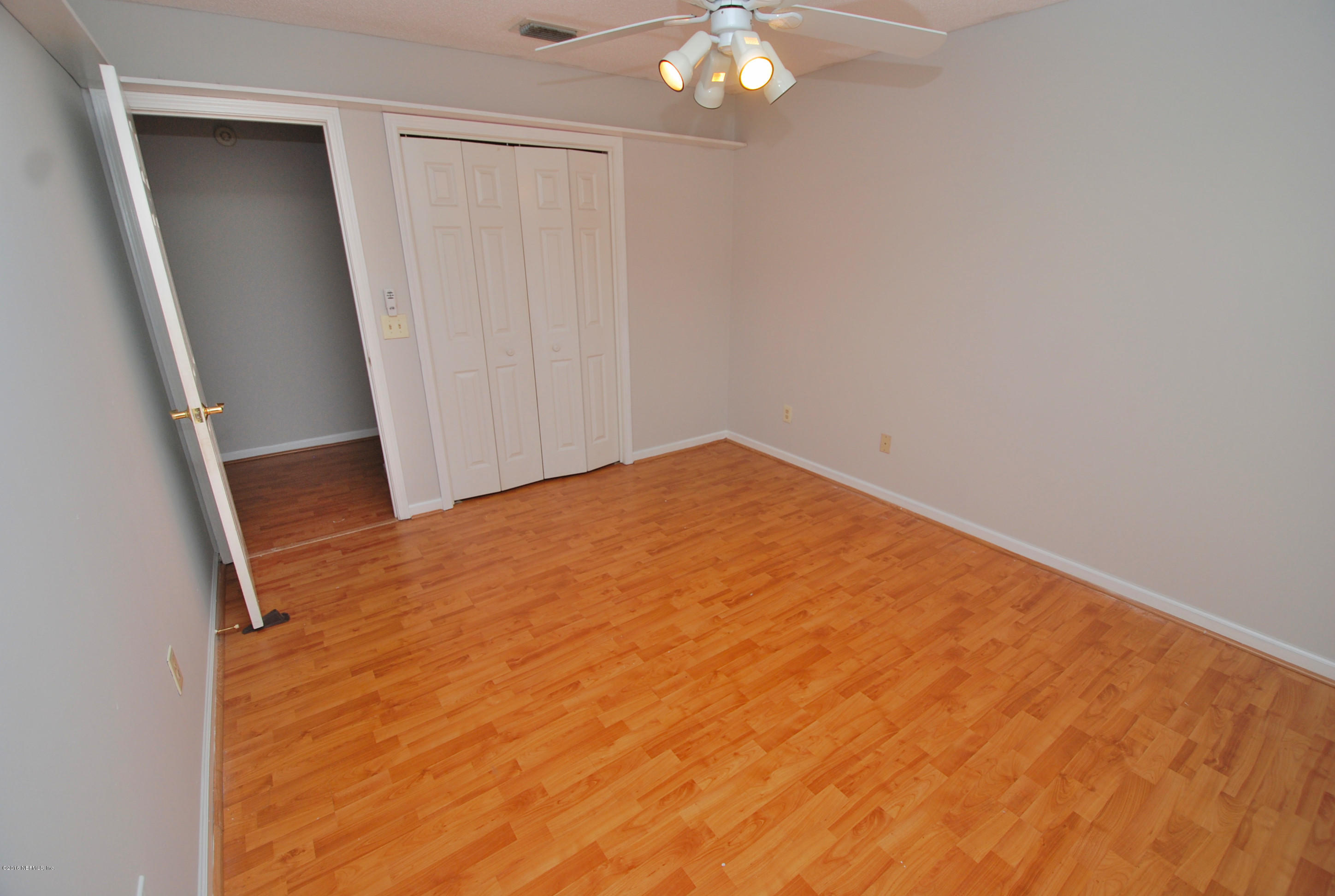 55581 Deer Run Road Callahan, FL 32011 - Photo 18 of 27 a view of empty room with wooden floor