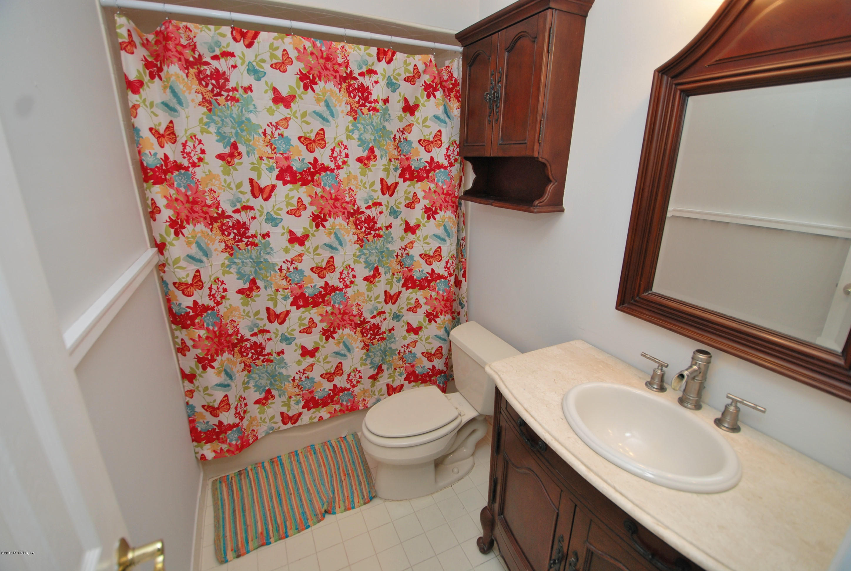 55581 Deer Run Road Callahan, FL 32011 - Photo 19 of 27 a bathroom with a sink toilet and shower