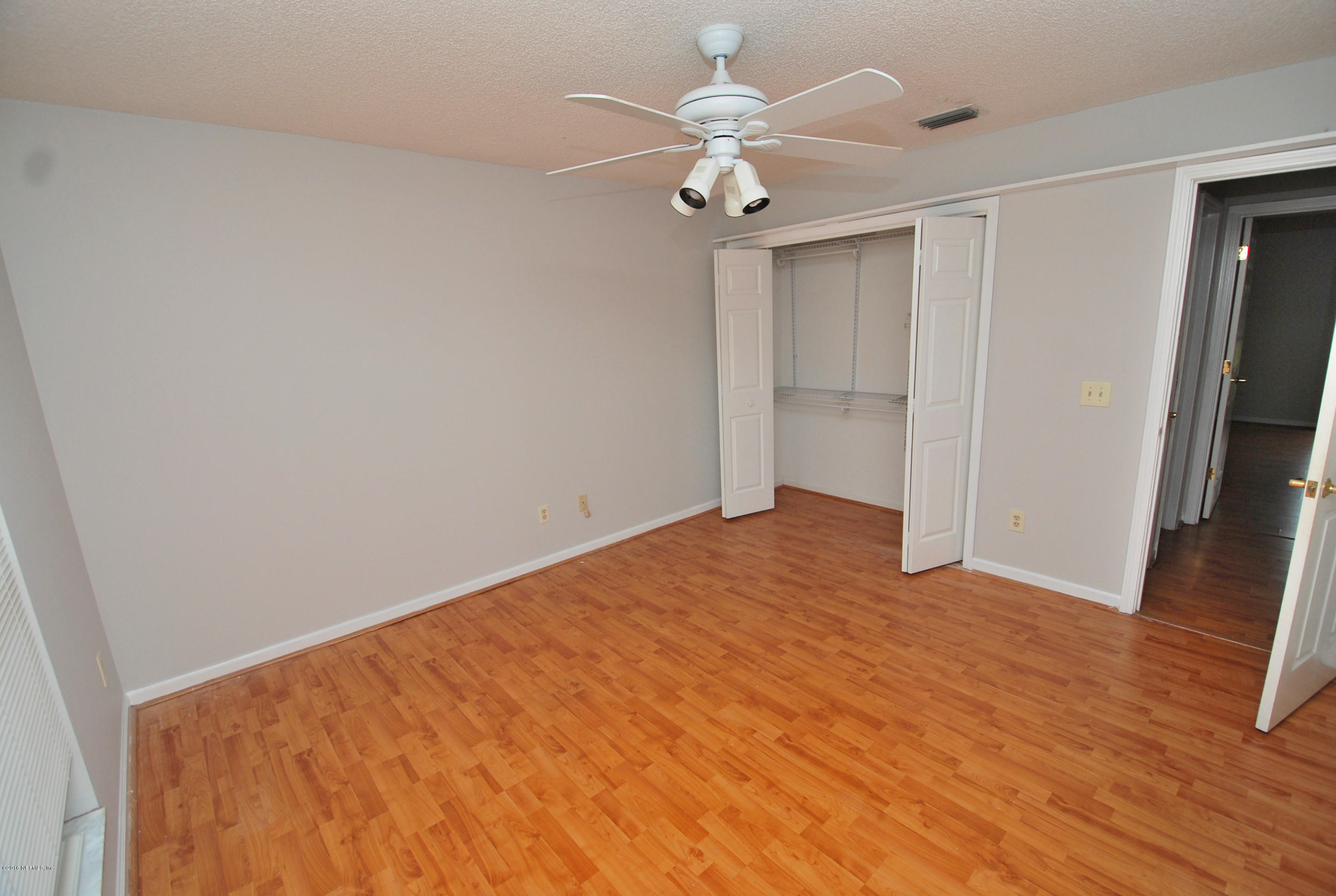 55581 Deer Run Road Callahan, FL 32011 - Photo 21 of 27 a view of an empty room with wooden floor