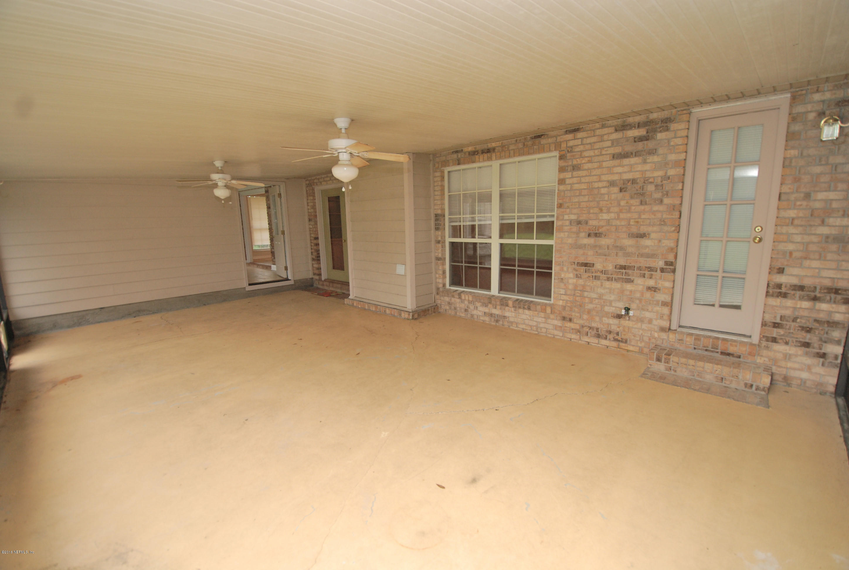 55581 Deer Run Road Callahan, FL 32011 - Photo 23 of 27 an empty room with windows
