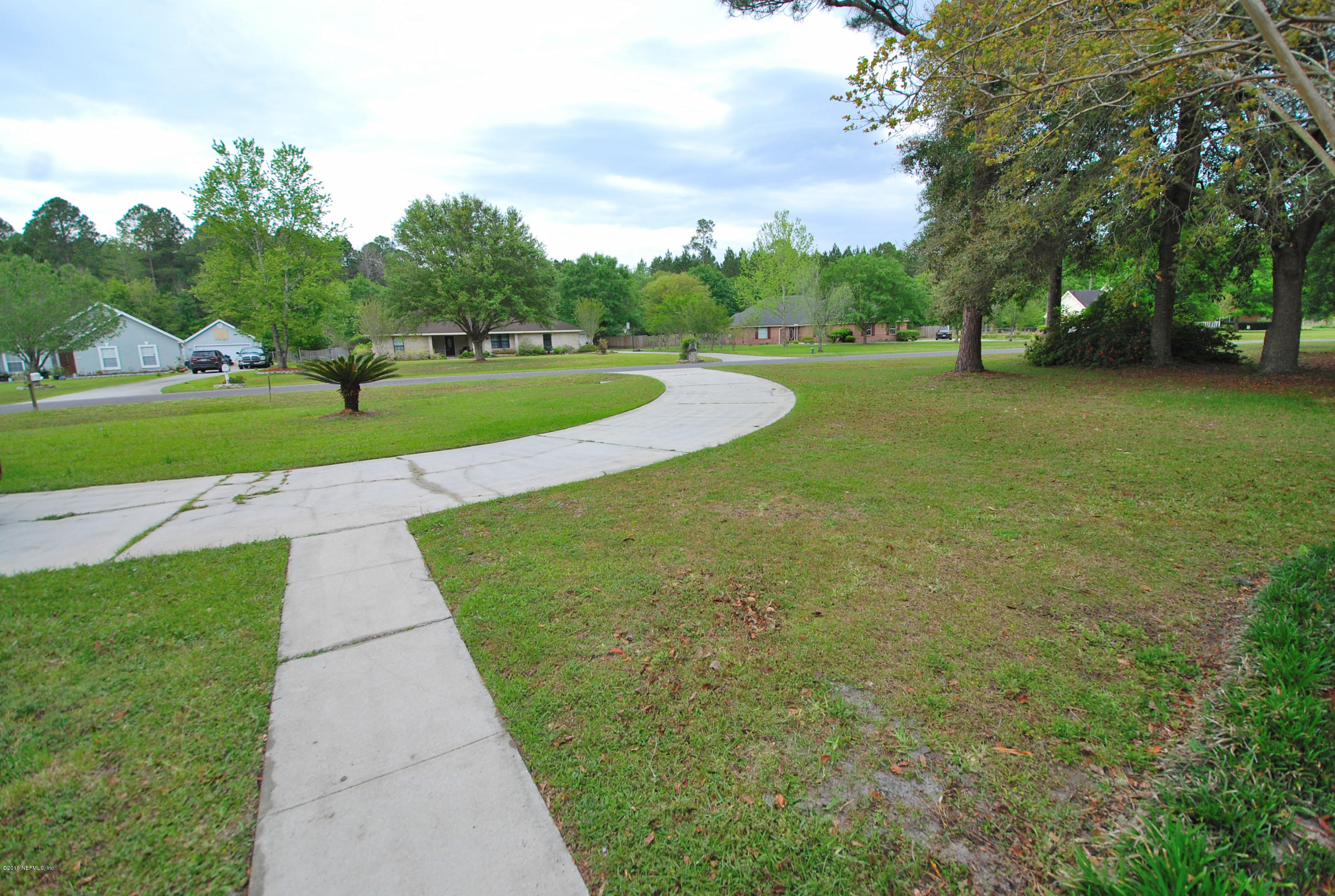 55581 Deer Run Road Callahan, FL 32011 - Photo 26 of 27 a view of a garden with houses