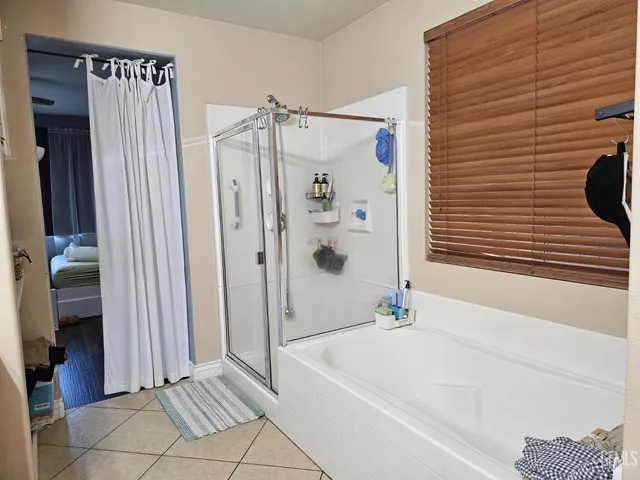 a view of a porch with furniture and a yard